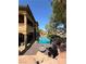 Inviting backyard pool area featuring a rock waterfall, spa, and lush landscaping for serene outdoor living at 1800 Amarone Way, Henderson, NV 89012