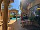Elegant backyard featuring a sparkling pool, detailed columns, and an inviting outdoor living area at 1800 Amarone Way, Henderson, NV 89012
