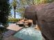 Hot tub with rock waterfall provides backyard outdoor living space at 1800 Amarone Way, Henderson, NV 89012