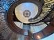 Spiral staircase with ornate wrought iron and decorative ceiling at 1800 Amarone Way, Henderson, NV 89012