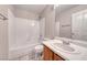 Bathroom featuring a tub and shower combo, a toilet and a wood vanity at 208 Genesee Point St, Henderson, NV 89074