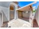 Front porch with a covered patio, front door, and textured concrete at 208 Genesee Point St, Henderson, NV 89074