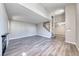 Inviting living room with a fireplace, high ceilings, and open staircase to the second floor at 208 Genesee Point St, Henderson, NV 89074