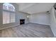 Spacious living room features vaulted ceilings, a fireplace, and large windows for plenty of natural light at 208 Genesee Point St, Henderson, NV 89074