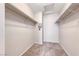 Walk-in closet features shelving with carpeted floors, offering ample storage space at 208 Genesee Point St, Henderson, NV 89074