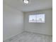 Bright bedroom featuring tile flooring and a window at 212 Orland St # 28, Las Vegas, NV 89107