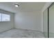 Bright bedroom featuring tile flooring, a sliding door closet and a window at 212 Orland St # 28, Las Vegas, NV 89107
