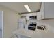 Bright kitchen features white cabinets, stainless steel appliances, and quartz countertops at 212 Orland St # 28, Las Vegas, NV 89107
