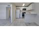 Cozy kitchen featuring stainless steel appliances, white cabinetry, and tile flooring at 212 Orland St # 28, Las Vegas, NV 89107
