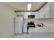 Cozy kitchen with white cabinets, stainless steel appliances, and bright countertop at 212 Orland St # 28, Las Vegas, NV 89107