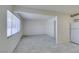 Open-concept living space with tile floors and neutral walls, connecting to kitchen and entryway at 212 Orland St # 28, Las Vegas, NV 89107
