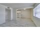 This cozy living room features tile flooring and neutral walls and is filled with natural light at 212 Orland St # 28, Las Vegas, NV 89107
