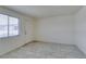 Bright living room featuring tile flooring, a front door and a large window at 212 Orland St # 28, Las Vegas, NV 89107