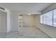 Bright living room featuring tile flooring, a large window and an opening to the kitchen at 212 Orland St # 28, Las Vegas, NV 89107