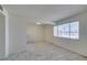 Bright living room featuring tile flooring and a large window, neutral color walls at 212 Orland St # 28, Las Vegas, NV 89107