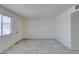 Bright living room featuring tile flooring, a front door and a large window at 212 Orland St # 28, Las Vegas, NV 89107