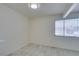 Inviting living room with tile flooring, fresh neutral paint, and natural light streaming through a large window at 212 Orland St # 28, Las Vegas, NV 89107