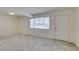 Bright living room featuring tile flooring, a window and a front door at 212 Orland St # 28, Las Vegas, NV 89107
