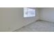 Bright living room features durable tile floors, neutral paint, and a large window for plenty of natural light at 212 Orland St # 28, Las Vegas, NV 89107