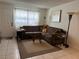 Comfortable living room with a large sectional sofa, accent pillows, and natural lighting at 2136 Bavington Dr # A, Las Vegas, NV 89108