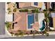 Aerial view of property featuring a private pool, covered patio, solar panels and well-kept landscaping at 2221 River Grove Dr, Henderson, NV 89044