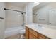 Bathroom featuring a shower-tub combo, neutral walls, and light oak cabinets at 2221 River Grove Dr, Henderson, NV 89044