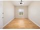 Bright bedroom with hardwood floors, a ceiling fan and a window with backyard views at 2221 River Grove Dr, Henderson, NV 89044