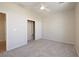Carpeted bedroom with a ceiling fan and sliding closet doors at 2221 River Grove Dr, Henderson, NV 89044