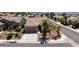 Charming single-story home featuring a tile roof and desert landscaping including a palm tree at 2221 River Grove Dr, Henderson, NV 89044