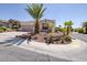 Beautiful single-story home with desert landscaping and a two car garage at 2221 River Grove Dr, Henderson, NV 89044