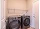 Laundry room equipped with modern LG washer and dryer set, featuring a wire shelf above at 2221 River Grove Dr, Henderson, NV 89044