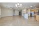 Bright and spacious living area with tile floors and a kitchen with stainless steel appliances at 2221 River Grove Dr, Henderson, NV 89044