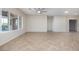 Open-concept living area with tile flooring, large windows and access to the backyard at 2221 River Grove Dr, Henderson, NV 89044