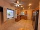 Open kitchen with stainless steel appliances, ample cabinetry, and a view to the exterior at 2504 Libretto Ave, Henderson, NV 89052
