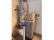 This utility room features a modern water heater and filtration system for efficient home operation at 2504 Libretto Ave, Henderson, NV 89052
