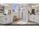 Modern bathroom with dual vanities, a glass-enclosed shower, and contemporary fixtures at 2615 Regency Cove Ct # Lot 13, Las Vegas, NV 89121