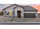 Beautiful single-story home featuring stone accents, a two-car garage, and desert landscaping at 2615 Regency Cove Ct # Lot 13, Las Vegas, NV 89121