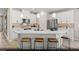 Bright kitchen with white cabinets, stainless steel appliances, quartz countertops, and pendant lighting at 2615 Regency Cove Ct # Lot 13, Las Vegas, NV 89121