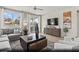 Stylish living room with large windows, modern furniture, and an open floor plan at 2615 Regency Cove Ct # Lot 13, Las Vegas, NV 89121