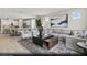 Spacious living room with a plush sofa, accent chairs, and an open view to the kitchen at 2615 Regency Cove Ct # Lot 13, Las Vegas, NV 89121