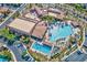 A beautiful aerial view of a resort style community pool with palm trees and lounge chairs at 280 Via Del Duomo, Henderson, NV 89011
