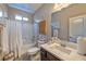 Well-lit bathroom with tub and shower combo, neutral walls, and ample counter space at 280 Via Del Duomo, Henderson, NV 89011