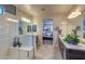 Modern bathroom boasts dual vanities, a glass-enclosed shower, and access to the main bedroom at 280 Via Del Duomo, Henderson, NV 89011