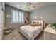 Cozy bedroom with shutters, neutral walls, ceiling fan, and stylish décor at 280 Via Del Duomo, Henderson, NV 89011