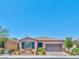 Charming single-story home with a well-manicured front yard and attached two-car garage at 280 Via Del Duomo, Henderson, NV 89011