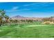 Picturesque golf course with manicured greens, mountain views, and clear blue skies at 280 Via Del Duomo, Henderson, NV 89011