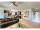 Open-concept living area showcases tile flooring, ceiling fan, and modern decor flowing into the kitchen at 280 Via Del Duomo, Henderson, NV 89011