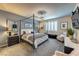 Well-lit main bedroom with a four-poster bed, plush carpeting, and contemporary furnishings at 280 Via Del Duomo, Henderson, NV 89011