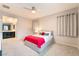 Comfortable bedroom with neutral decor, access to bathroom, and plush carpeting at 2860 Sunflower Days Ave # 2141, North Las Vegas, NV 89031