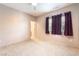 Inviting bedroom featuring neutral carpet and window with sheer curtains at 2860 Sunflower Days Ave # 2141, North Las Vegas, NV 89031